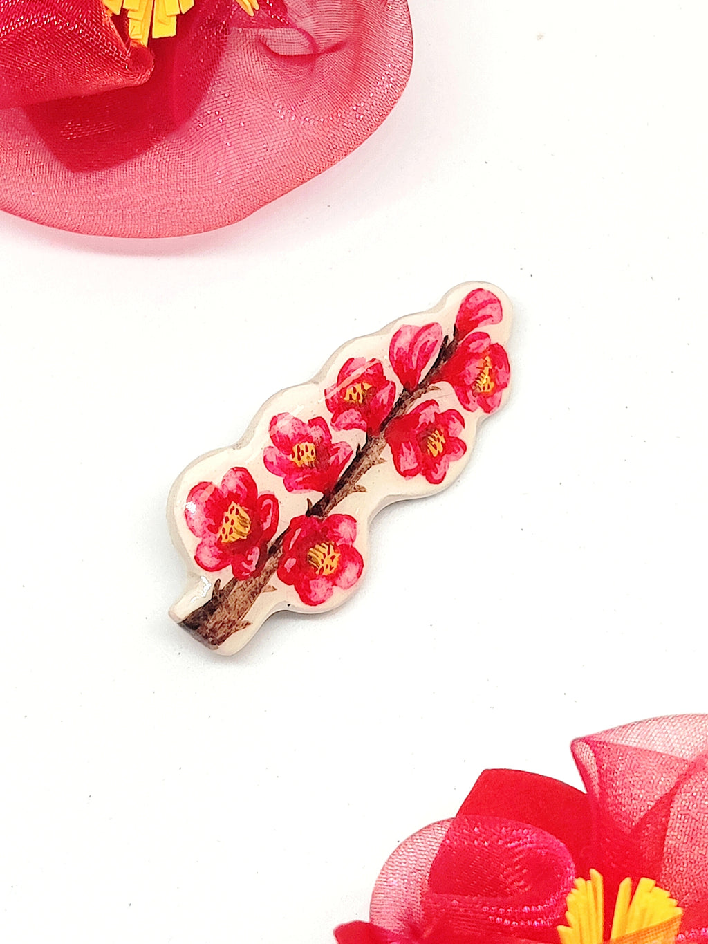 Broche Kusa